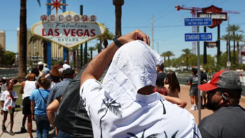 Trees line a walkway by a river (Credit: Getty Images)