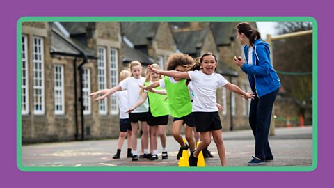 Primary children in the UK doing a physical education lesson.