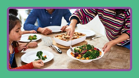 A family eating a balanced meal at a dining table.