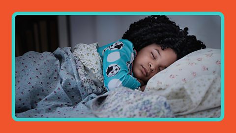 A child sleeping in bed.