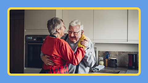 An elderly couple dancing