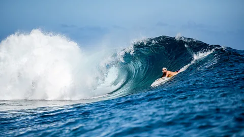 Locals take in the view of the new Olympic judging tower from their boat at Teahupo'o, Tahiti (Credit: Atea Lee Chip Sao)