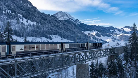 The GoldenPass Express going by a lake (Credit: Alamy)