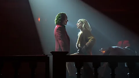 A still of Joaquin Phoenix and Lady Gaga in Joker: Folie à Deux (Credit: Niko Tavernise)