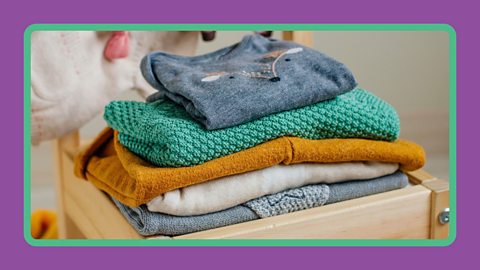 Organic cotton children's clothing on a chair.