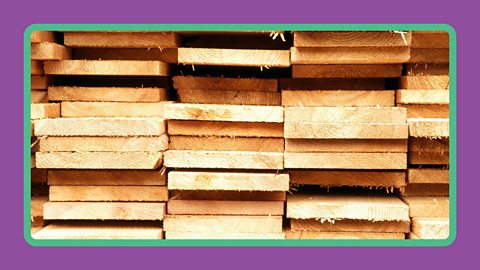 Stacked boards of larch timber.