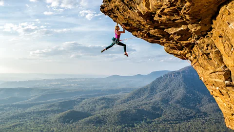 Climber hanging off cliff in the Blue Mountains, Australia (Credit: Simon Carter)