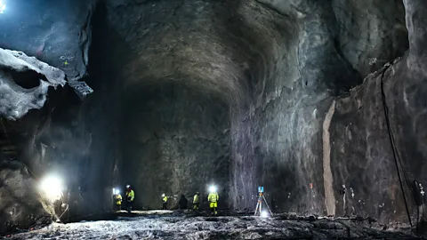 Workers in giant cavern for nuclear waste (Credit: Tapani Karjanlahti/ TVO)