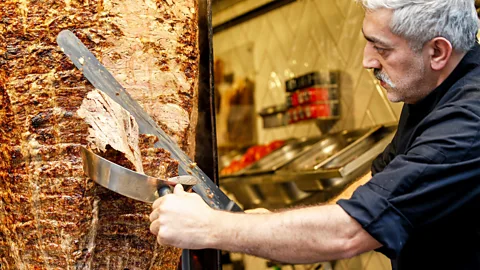 Man slicing doner meat in Istanbul, Turkey (Credit: Alamy)