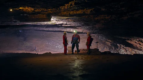 BBC Journalist, Katherine Latham, interviews caver, Phil Short, in Wookey Hole Cave (Credit: Fran Gomez de Villaboa)