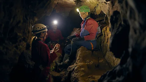 BBC Journalist, Katherine Latham, interviews caver, Phil Short, in Wookey Hole Cave (Credit: Fran Gomez de Villaboa)