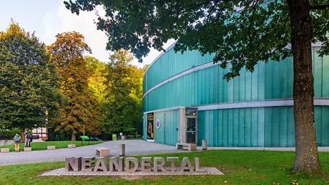 Exterior of Neanderthal Museum with a sculpture of the word "neanderthal" (Credit: Alamy)