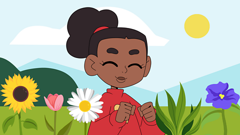 A girl looking happy in a field of flowers