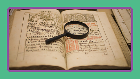 A historical text written in Greek with a magnifying glass.