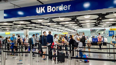 Travellers in line at UK customs (Credit:Getty Images)