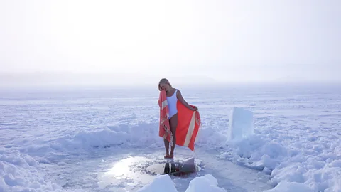 Ice swimmer Elina Mäkinen in an ice hole in Finland (Credit: Taneli Kantanen)