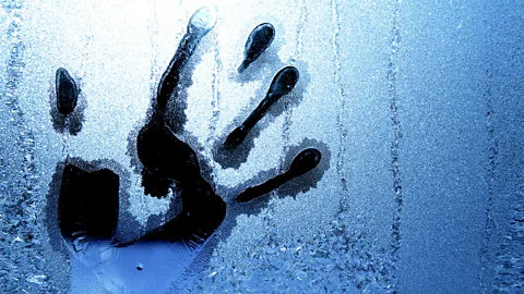 Human hand print in frosted window (Credit: Getty Images)