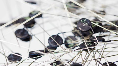 Pile of thermistors type NTC of resistance 10 OHM on a white background