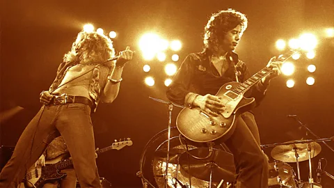 Two members of Led Zeppelin performing on stage (Credit: Getty Images)