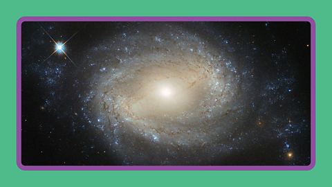 A swirling spiral galaxy in space.