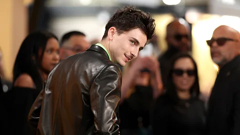 Timothée Chalamet turning his head to the right to face the cameras on the red carpet of the SAG Awards 2025 (Credit: Getty Images)