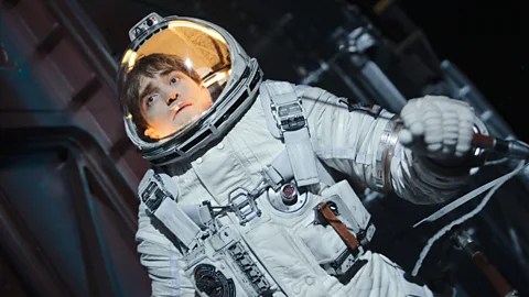 Robert Pattinson in a spacesuit in Mickey 17 (Credit: Courtesy of Warner Bros)