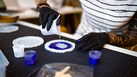 Pouring clear epoxy resin into a mould