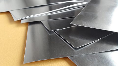 A beta source is used because beta radiation can only penetrate a few mm of aluminium.