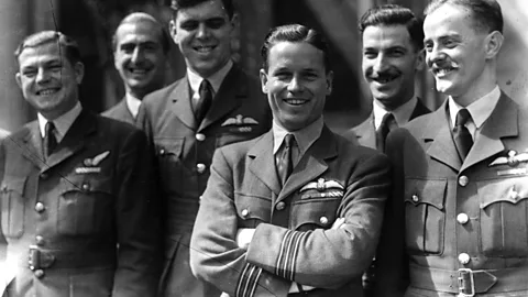 A group of six airmen smile and pose together (Credit: Getty Images)