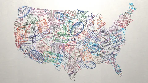 An illustration of a map of the US made of travel stamps (Credit: Getty Images)