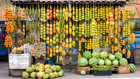 Traditional fruit stand in the Amazon lined with exotic fruits (Credit: Alamy)