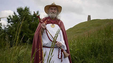 Rollo Maughfling, the Archdruid of Stonehenge, stands in front of Glastonbury Tor (Credit: Francisco Gomez de Villaboa)
