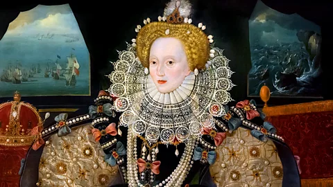 The Armada Portrait of Queen Elizabeth I, showing Elizabeth in the foreground and the fleet of ships in the background (Credit: Alamy)