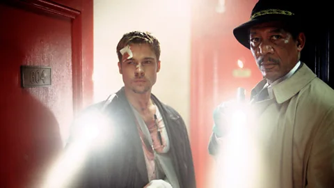 Brad Pitt and Morgan Freeman holding torches in Seven (Credit: Alamy)
