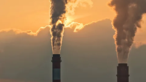 Smoke rising from chimneys at a power plant in eastern China (Credit: Getty Images)