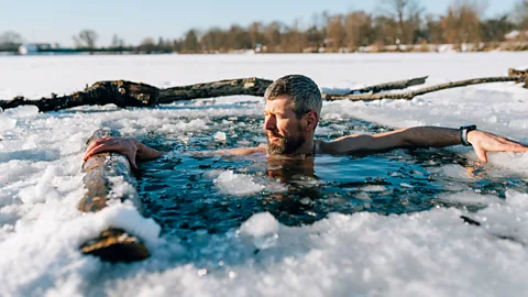 Man bathing in icy lake (Credit: Getty Images)
