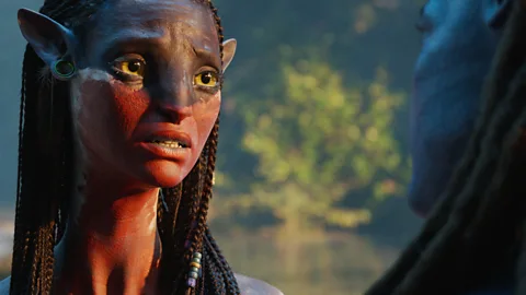 A still of a Na'vi alien with a sad expression in Avatar: Fire and Ash (Credit: Disney)