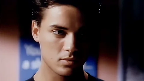 Still of topless Nick Kamen in the Levi's ad in a retro launderette (Credit: 'Launderette' Levi's advertisement, Bartle Bogle Hegarty))