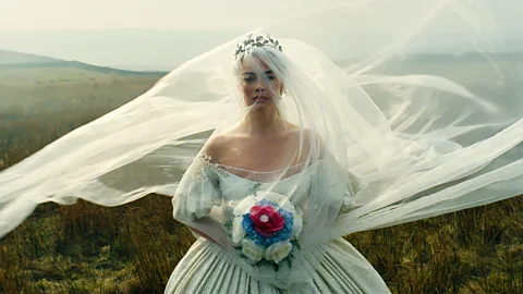 Margot Robbie in a wedding dress as Catherine in "Wuthering Heights" (Credit: Warner Bros. Pictures)