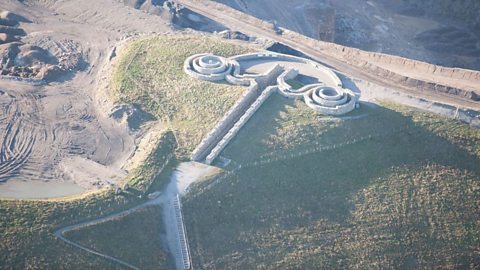 On the edge of a quarry a walled path leads to a viewing platform with two spiral walks coming off each side