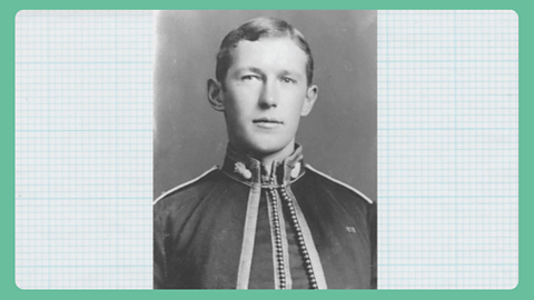 A black and white photograph of a young man's head and shoulders wearing a uniform