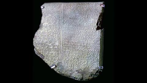 A stone tablet, on it written in an ancient language is part of 'The Epic of Gilgamesh'.