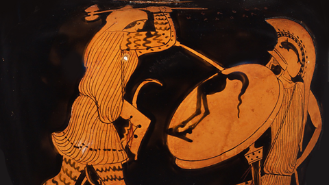 A scene from an Ancient Greek vase of a battle. One soldier holds up a shield and points a spear as the other attempts to attack using a weapon.