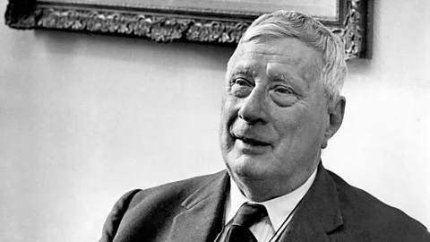 L. S Lowry's painting 'Going to the Match' (1953). It's a painting of a large square with hundreds of people pouring into a Bunden Park stadium, with the skyline of Bolton in the background (Credit: The Estate of L.S. Lowry)