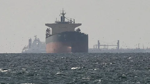 World Business Report, Shipping companies still reluctant to pass through Strait of Hormuz.