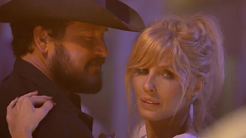 Kelly Reilly and Cole Hauser dancing together in Dutton Ranch (Credit: Paramount)