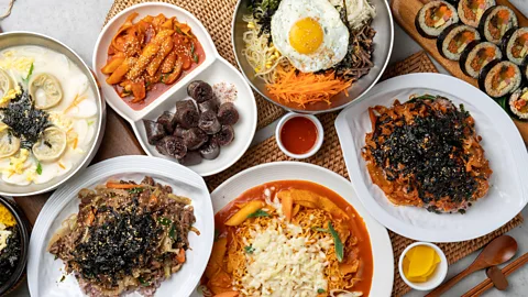 A variety of Korean dishes and banchan on a table (Credit: Alamy)