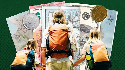A blonde woman traveller wearing a backpack holds the hands of her two blonde children, who are also wearing backpacks, against a dark green global currency background