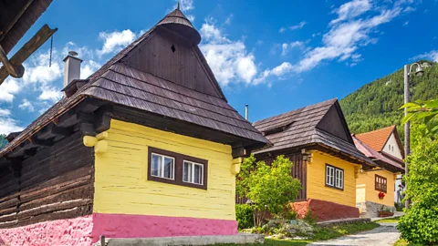 Colourful yellow-faced wooden log houses of Vlkolínec, Slovakia (Credit: Getty Images)