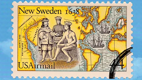 A commemorative New Sweden Joint Issue stamp depicting a map of the area and a colonial man meeting with Native Americans (Credit: BBC/ Serenity Strull/ Getty Images)